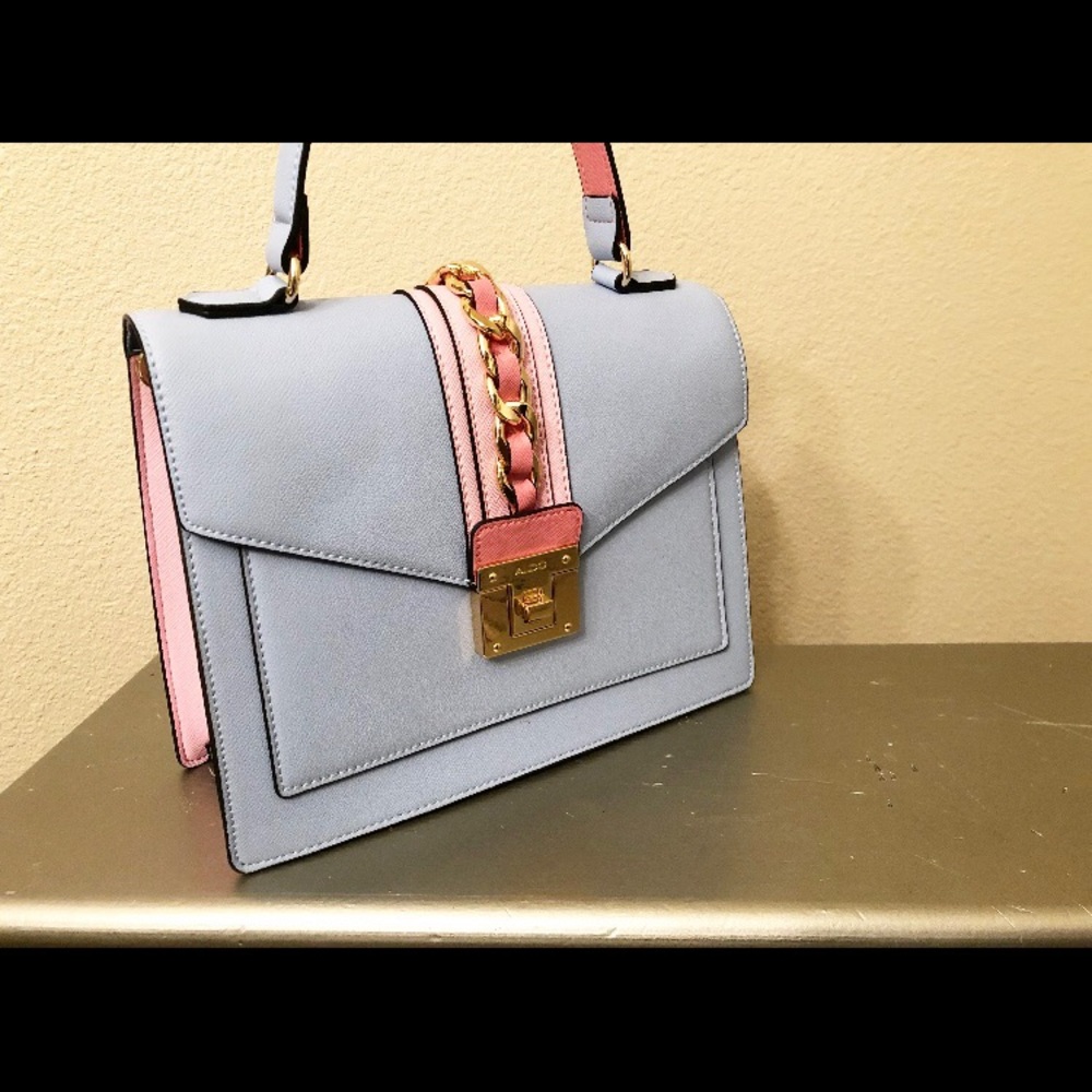 Top handle, crossbody handbag.